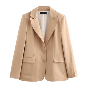 Close-up of camel slim-fit blazer with notched lapels and gold buttons on woven fabric