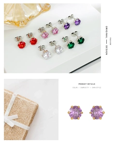 Detail of colorful zircon stud earrings in six-prong settings with gold and silver finish
