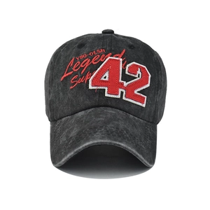 Close-up of vintage washed black baseball cap with red and white 3D 42 Legend embroidery