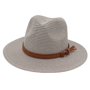 Close-up of grey Fedora hat showing straw texture and brown leather belt with tassel