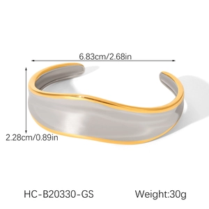 Detail view of wavy two-tone stainless steel bangle with dimensions and weight info
