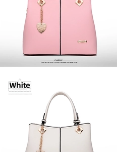 Detail view of pink and white fashion tote bags featuring heart pendants and gold hardware