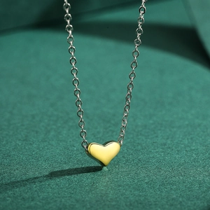 Minimalist S925 sterling silver necklace with a polished gold 3D heart-shaped pendant