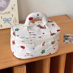 Detailed view of quilted Christmas dachshund makeup bag with top handle and dual zippers