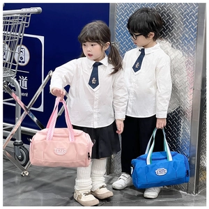 Pink and blue children sports bags with striped handles held by boy and girl models