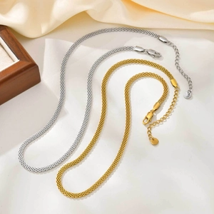 Flat mesh chain necklace in gold and silver finish with lobster clasp and extension