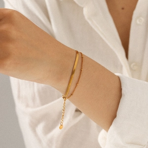 Double-layer 18k gold-plated stainless steel bracelet with snake and bead chains on wrist
