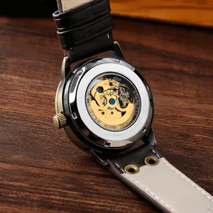 Macro view of retro automatic mechanical watch showing transparent back and gear movement