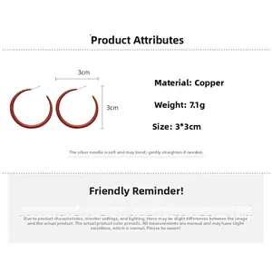 Detail view of red enamel C-shaped hoop earrings with S925 silver needles and 3cm size specs