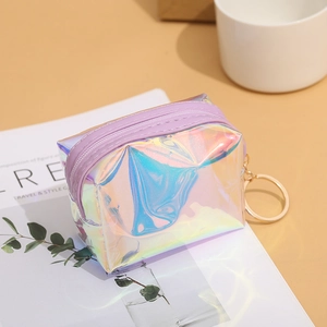 Detail of laser iridescent coin purse with purple zipper and golden keychain clip