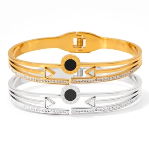 Roman numeral bangles in gold and silver with black and white inlay and crystals