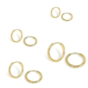 Set of four pairs of polished golden stainless steel hoop earrings in varying diameters