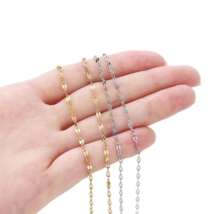 Detail of gold and silver stainless steel flat curb and cross link chains for DIY jewelry