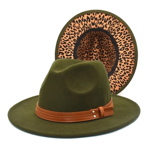 Detail of olive green wool fedora with brown leather strap and leopard print lining