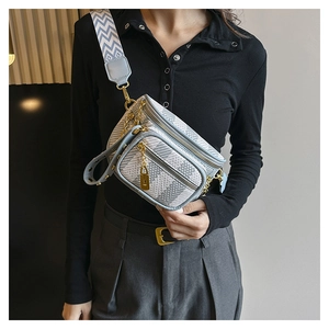 Detailed shot of a blue checkered crossbody chest bag with adjustable patterned strap