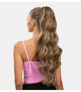 Detail of honey blonde water wave ponytail extension with drawstring attachment