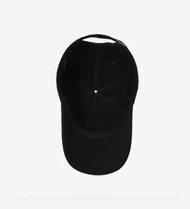 Detailed inner view of black cotton baseball cap showing lining, sweatband and stitching