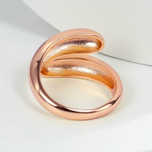 Elegant rose gold teardrop spiral ring with smooth finish and adjustable open band design