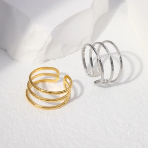 Detail showing triple-layered open titanium steel rings with textured hammered finish