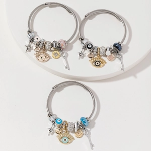 Adjustable silver beaded bracelets with evil eye, star, and key charms in various colors