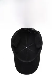 Detail view of winter baseball cap with hidden ear flaps and thick warm fleece lining