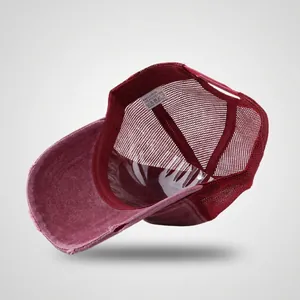 Vintage burgundy distressed mesh trucker hat with washed denim finish and curved brim