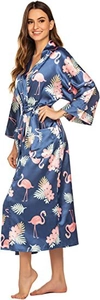 Detail of dark blue satin robe featuring pink flamingo prints and tropical leaf patterns