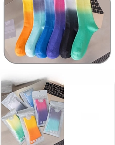 Close-up of vibrant gradient mid-calf socks with high-quality individual eco-packaging