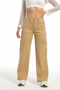 Detail of high waist khaki cargo pants featuring large side pockets and cotton twill fabric