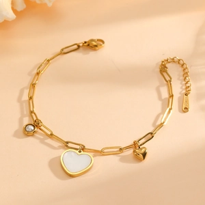 Detail of 18K gold plated heart bracelet with mother of pearl and delicate pearls