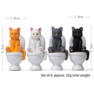 Set of 4 miniature resin cats sitting on white toilets for creative garden landscaping
