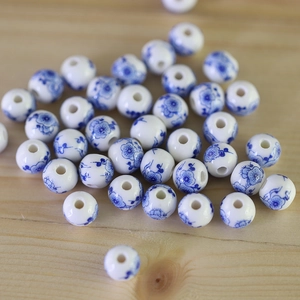 Macro shot of blue and white porcelain round beads for DIY jewelry and hair accessories