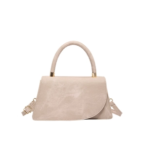 Minimalist beige trapezoid crossbody handbag with asymmetric flap and gold hardware