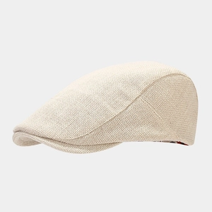 Detail shot of beige breathable woven fabric and texture on the vintage beret hat