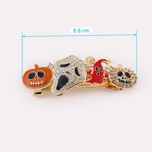 Detail of 8.8cm Halloween hair clip featuring pumpkins, ghosts and skulls with rhinestones