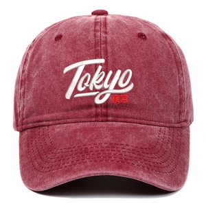 Close-up of Tokyo embroidery on vintage washed burgundy cotton baseball cap