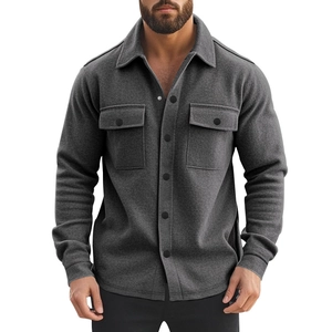 Detail of dark grey fleece-lined shirt jacket with flap chest pockets and buttons