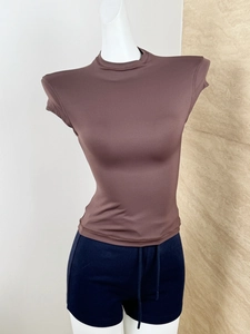 Detailed close-up of dark coffee mock neck short sleeve slim fit athletic t-shirt