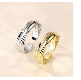 Detailed macro view of S925 sterling silver stamp on wave pattern open rings