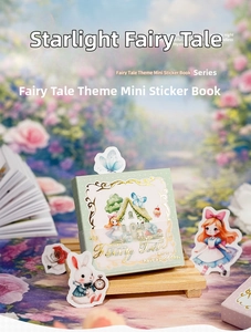 Macro shot of magical fairy tale sticker book with gold foil details and fantasy motifs