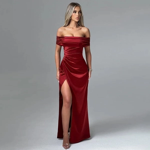 Detail of off-shoulder satin gown with pleated waist and high side slit in deep red