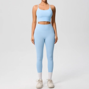 Light blue two-piece yoga set with thin strap sports bra and high-waisted leggings