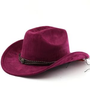Detail of burgundy suede cowboy hat with braided leather band and antique metal buckle