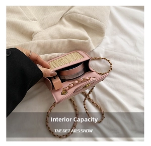 Internal view of pink mini woven bag showing capacity for lipstick and powder compact