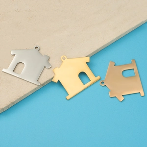 Three 35mm house-shaped stainless steel pendants in silver, gold, and rose gold finishes