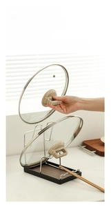 Close-up of dual-tier kitchen pot lid holder with wood grain tray and metal frame