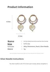Detail view of pearl heart earrings with 4.3x2.3cm dimensions and rhinestone accent