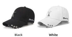 Detail of baseball cap with metal rings, Eiffel Tower pendant and Paris embroidery