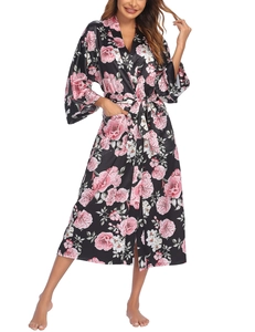 Detail of floral black satin robe with pink peonies, kimono sleeves and tie waist