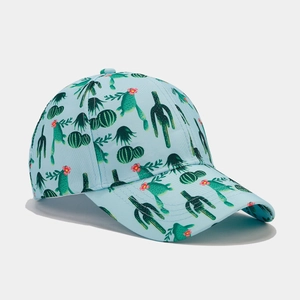 Detail of tropical cactus and pink flower print on breathable light blue baseball cap